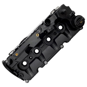 Top view of Audi cylinder head cover showing oil filler cap port and PCV valve housing